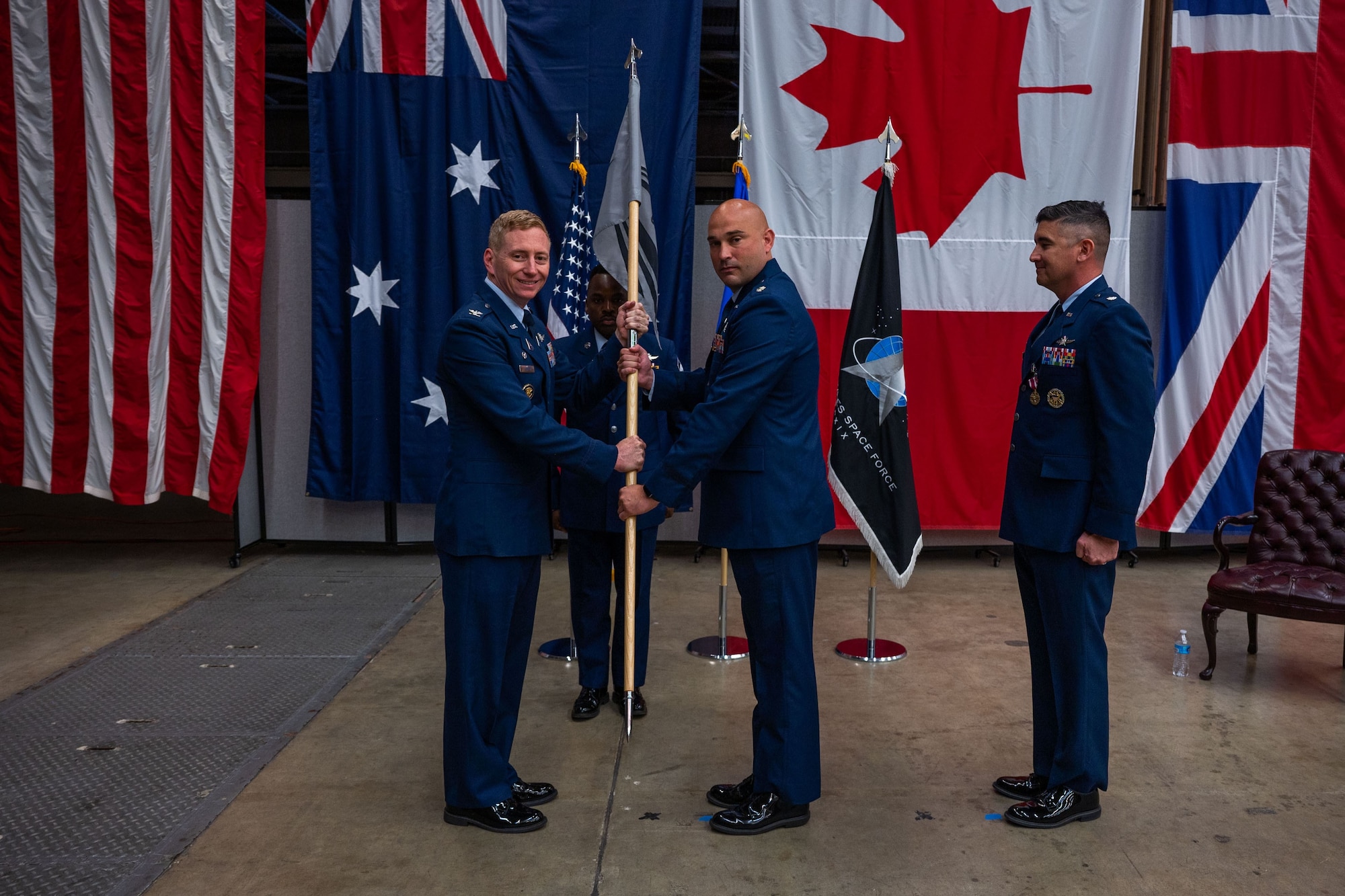 Passing of the guidon during change of command ceremony.