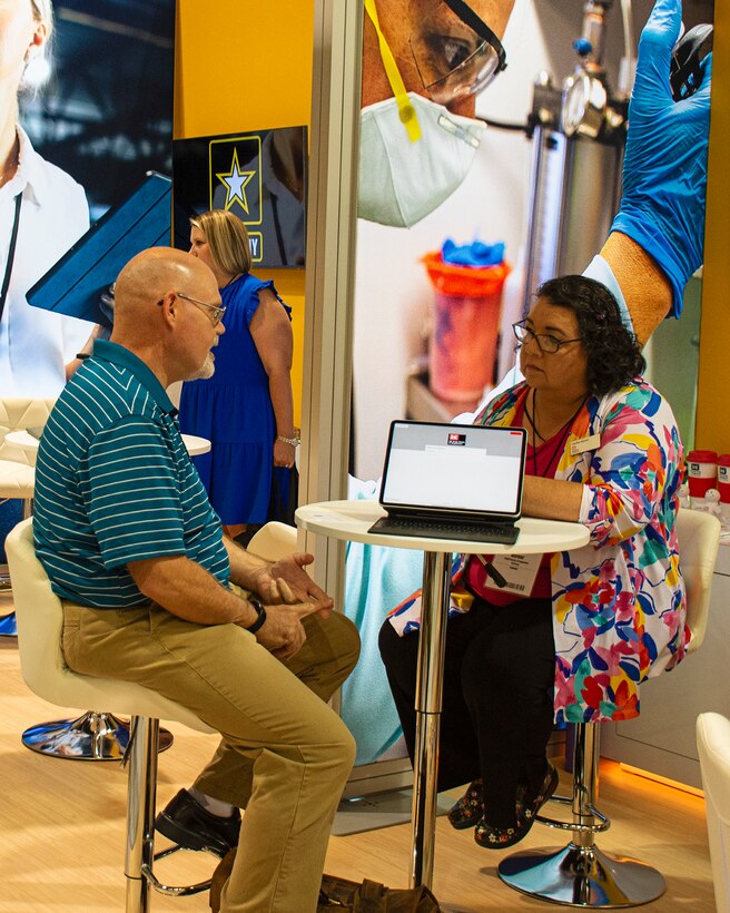 Cecilia Horner, chief, Engineering and Construction Division, Albuquerque District, speaks with a job applicant during the during the job expo which was part of the 2023 League of United Latin American Citizens (LULAC) National Convention & Exposition, Aug. 2, 2023, at the Albuquerque Convention Center.