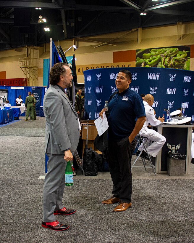 Scott Gemmill, left, with the USACE-Talent Acquisition Center of Excellence speaks with a job applicant during the job expo at the 2023 League of United Latin American Citizens (LULAC) National Convention & Exposition, Aug. 3, 2023. USACE recruiters made 11 job offers with more pending during the expo.