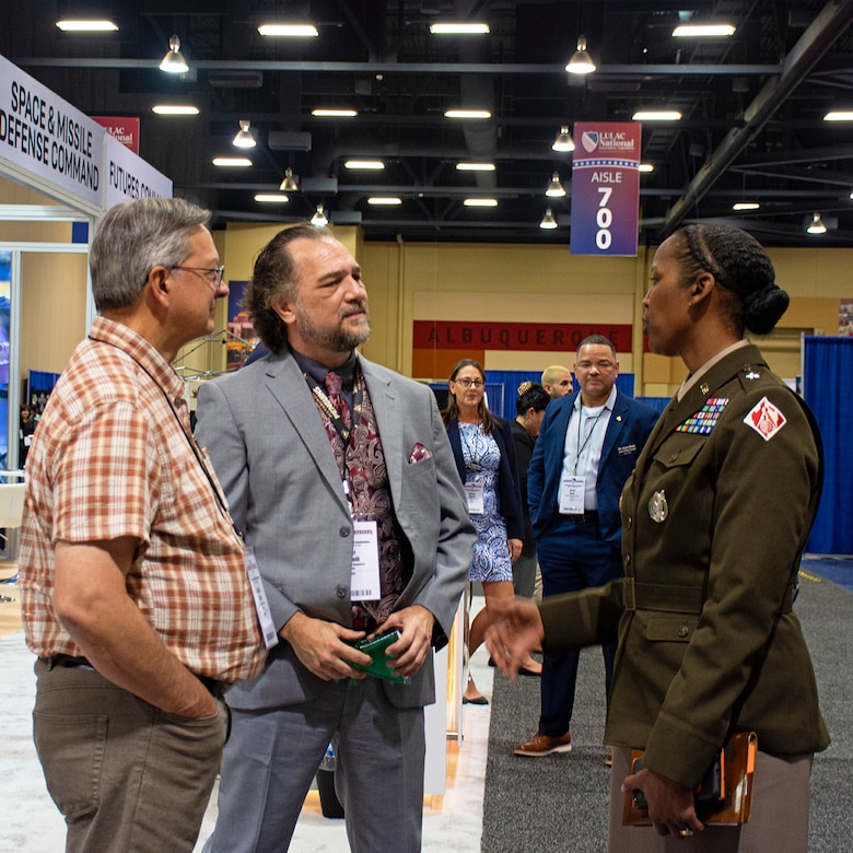 Brig. Gen. Antoinette Gant, commanding general, USACE-South Pacific Division, right, visited Albuquerque, N.M., for the 2023 League of United Latin American Citizens (LULAC) National Convention & Exposition. She stopped by the USACE exhibit at the job expo, Aug. 3, to visit with USACE recruiters. (l-r): Richard Wells, chief, Military Design Branch, Sacramento District; Scott Gemmill, USACE-Talent Acquisition Center of Excellence; Brig. Gen. Antoinette Gant.