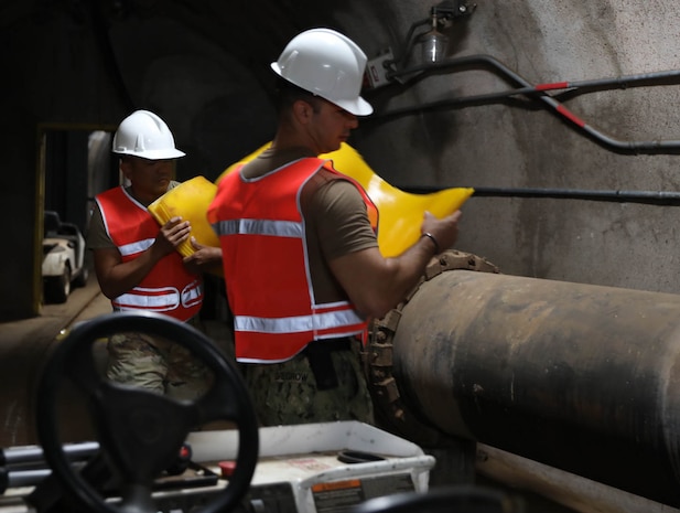 Service members assigned to Joint Task Force-Red Hill (JTF-RH) stage drain covers during the implementation of additional aquifer protective measures at the Red Hill Bulk Fuel Storage Facility (RHBFSF), Halawa, Hawaii, Aug. 10, 2023. JTF-RH is in phase three of its five-phase defueling plan. Personnel are focused on completing quality control tasks, training, response preparation, the National Environmental Policy Act Environmental Assessment, regulatory approvals and operational planning for all major milestones. This extensive preparatory work will help ensure the safe and expeditious defueling of the RHBFSF. (DoD photo by U.S. Army Staff Sgt. Randall E. Corpuz)