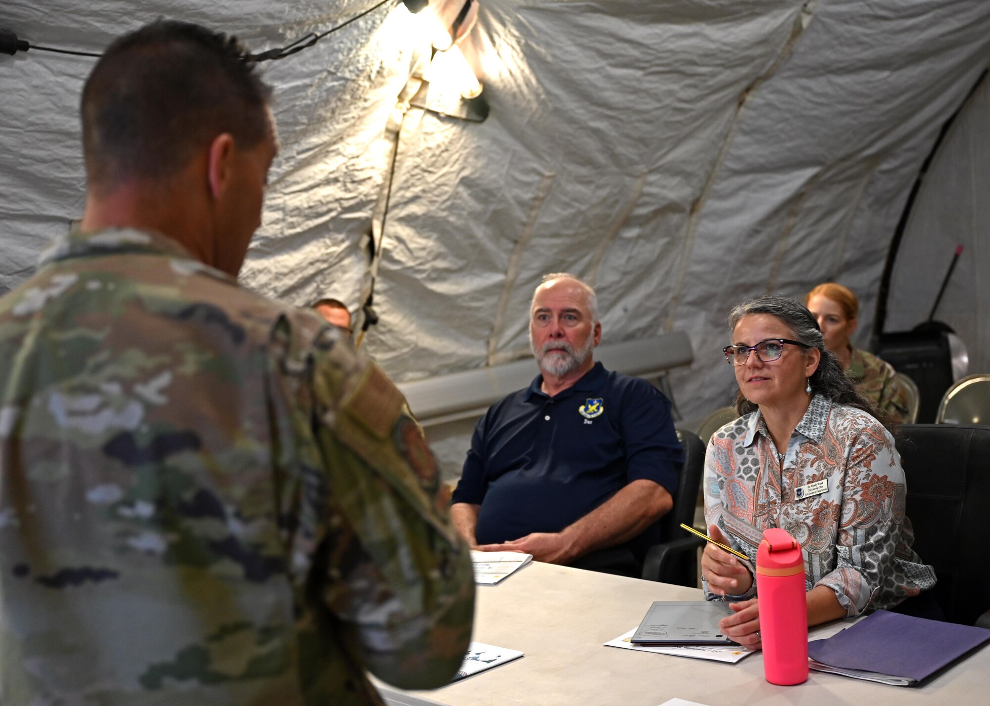 Dr. Wendy Walsh, Air Education and Training Command chief learning officer, listens to a brief at Joint All Domain Exercise, Forward Operations Readiness Generation Exercise, Goodfellow Air Force Base, Texas, Aug. 8, 2023. JADE FORGE is the newest initiative to the 17th Training Wing to enhance training for intelligence, surveillance and reconnaissance Airmen and joint partners. (U.S. Air Force photo by Senior Airman Sarah Williams)