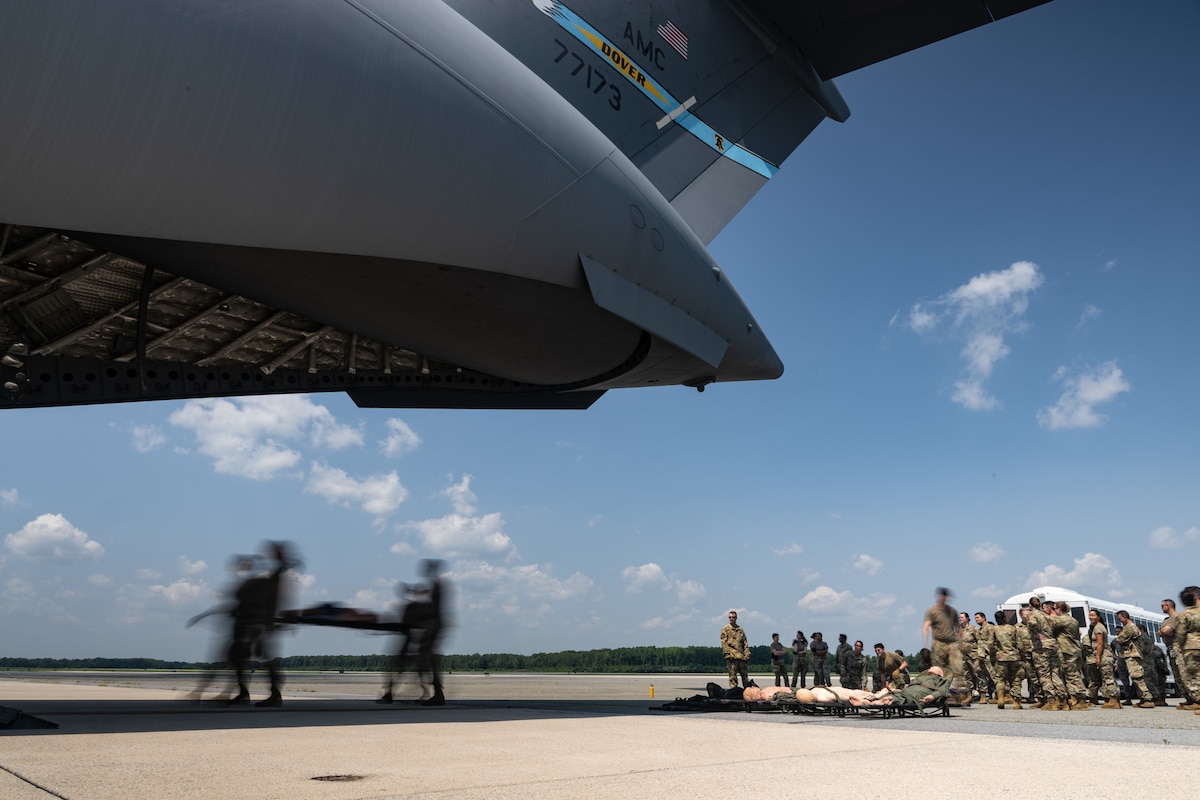Airmen from the 142nd Aeromedical Evacuation Squadron, Delaware Air National Guard Base, New Castle, Delaware, train 436th Medical Group medics on patient load and offload procedures onto a C-17 Globemaster III during MEDIC-X training held at Dover Air Force Base, Delaware, Aug. 9, 2023. MEDIC-X is the Air Force Surgeon General’s Multi-Capable Airmen initiative to ensure all medical personnel, clinical and non-clinical, are equipped with life-sustaining skills needed for future conflicts where resources may be limited. (U.S. Air Force photo by Staff Sgt. Marco A. Gomez)