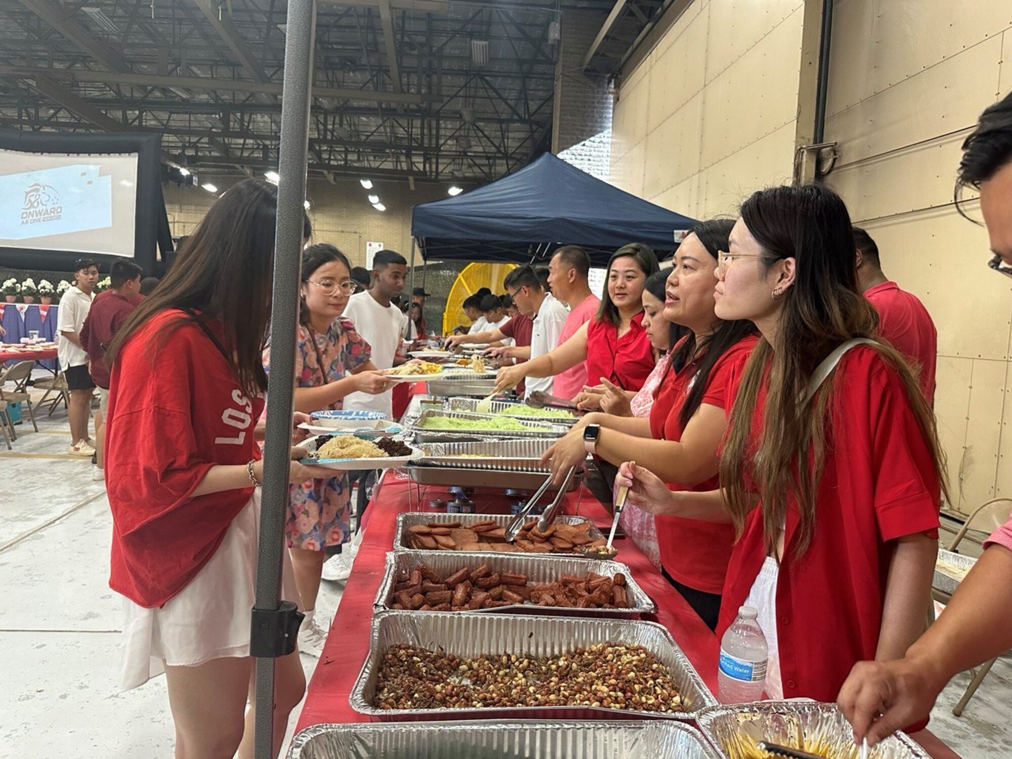 56th Fighter Wing Airmen and leadership celebrate alongside their Republic of Singapore Air Force partners with a potluck at a National Day of Singapore event Aug. 8, 2023, at Luke Air Force Base, Arizona.