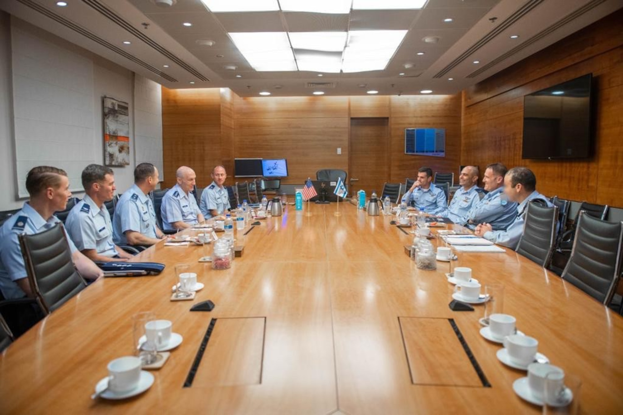 U.S. Air Force Vice Chief of Staff Gen. David Allvin (center left), Israeli Air Force Chief of Staff Brig. Gen. Eyal Grinboim (center right) and colleagues hold a discussion at the Air Senior National Representatives forum in Tel Aviv, Israel, Aug. 3, 2023. The leaders discussed areas of cooperative opportunities and postured for the future during this year’s iteration. (Courtesy photo)