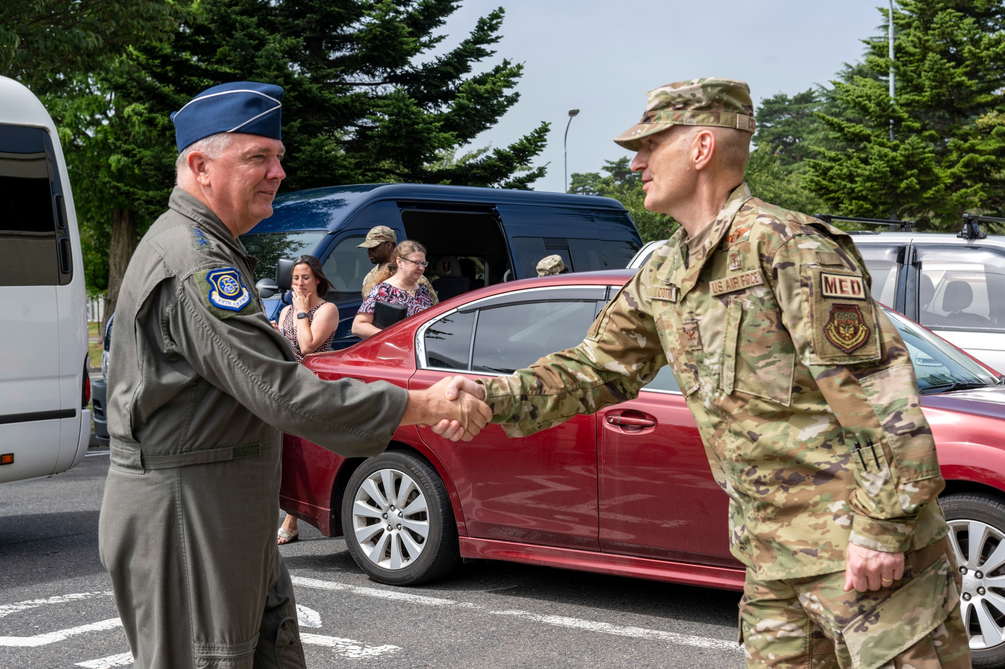 Two individuals shaking each other hands when meeting.