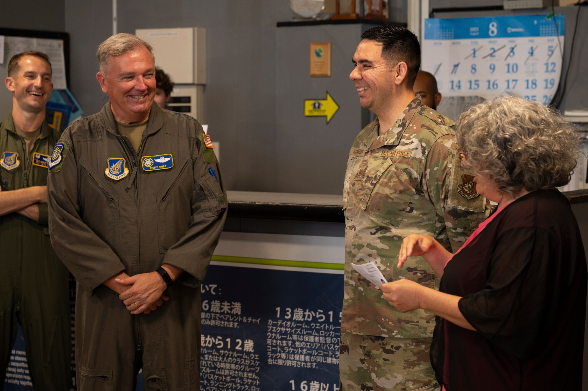 Military members celebrate as an individual get highlighted for his work.