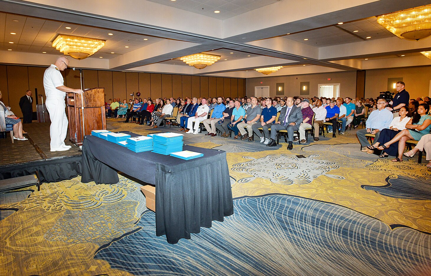 Capt. Al Palmer, Fleet Readiness Center Southeast’s (FRCSE) commanding officer, addresses an audience of 500 attendees during FRCSE’s 2023 apprentice graduation ceremony at Southbank Hotel Jacksonville Riverwalk. FRCSE launched the renewed apprenticeship program in 2019, a combination work-study program that provides apprentices with a competitive wage and benefits while learning a journey-level trade. (U.S. Navy Photo by Toiete Jackson/Released)