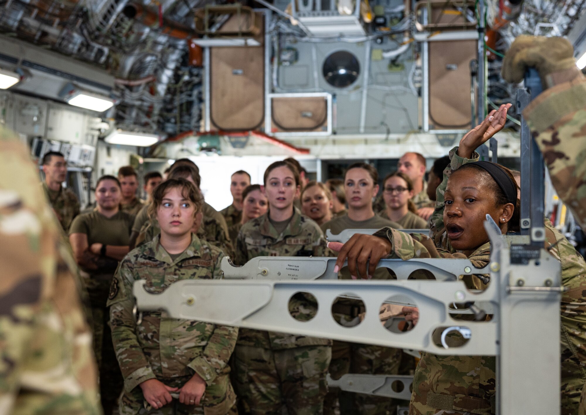 Maj. Kemeshia Greene, right, 142nd Aeromedical Evacuation Squadron chief of aircrew training, Delaware Air National Guard Base, New Castle, Delaware, teaches Team Dover Airmen how to load and unload injured patients from the C-17 Globemaster III at Dover Air Force Base, Delaware, Aug. 9, 2023. MEDIC-X is the Air Force Surgeon General’s Multi-Capable Airmen initiative to ensure all medical personnel, clinical and non-clinical, are equipped with life-sustaining skills needed for future conflicts where resources may be limited. (U.S. Air Force photo by Airman 1st Class Dieondiere Jefferies)
