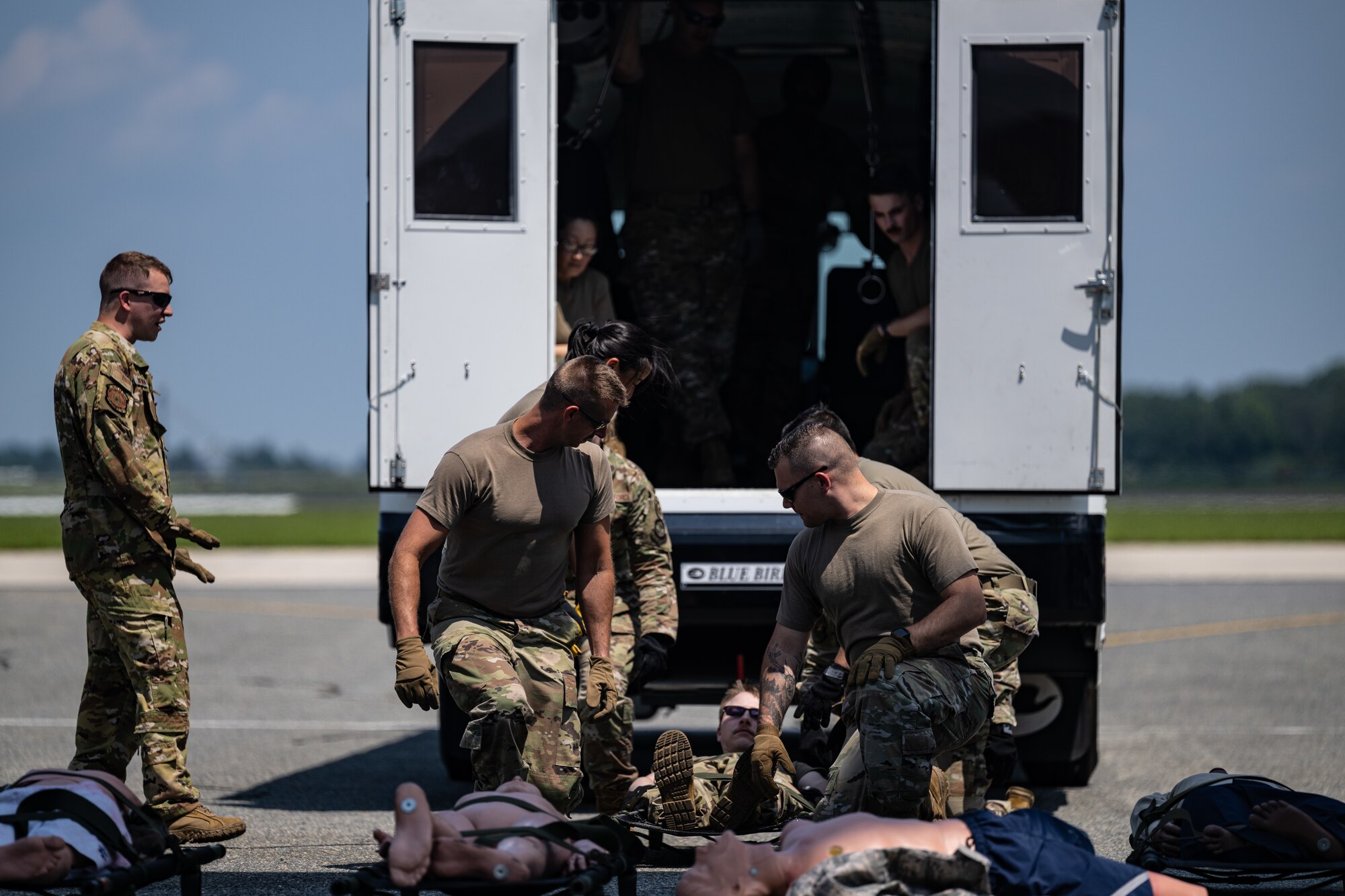 Master Sgt. James Kreiman, left, 142nd Aeromedical Evacuation Squadron aeromedical evacuation technician, Delaware Air National Guard Base, New Castle, Delaware, instructs 436th Medical Group Airmen how to lift a patient on a stretcher during MEDIC-X training held at Dover Air Force Base, Delaware, Aug. 9, 2023. MEDIC-X is the Air Force Surgeon General’s Multi-Capable Airmen initiative to ensure all medical personnel, clinical and non-clinical, are equipped with life-sustaining skills needed for future conflicts where resources may be limited. (U.S. Air Force photo by Staff Sgt. Marco A. Gomez)