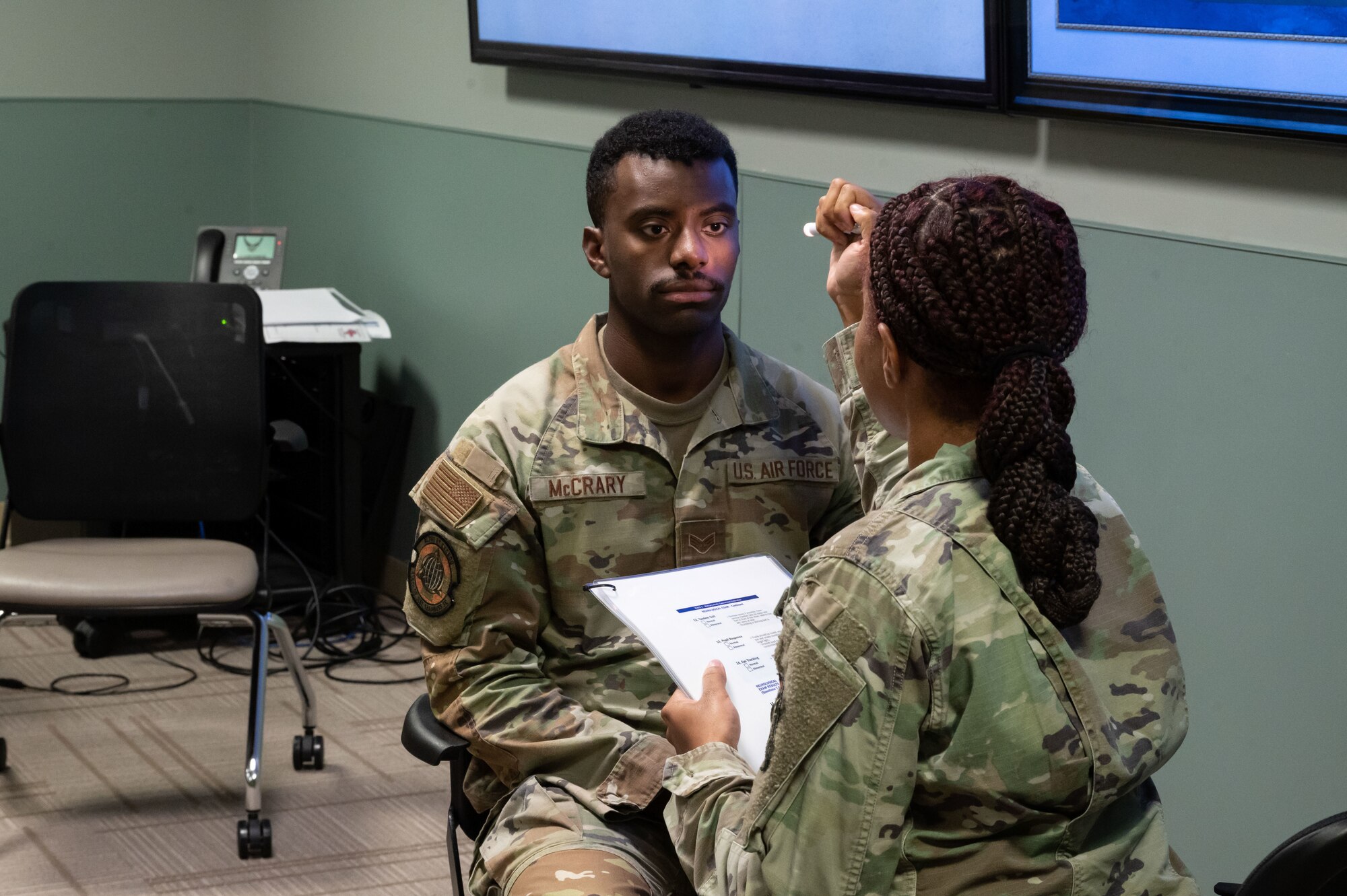 Staff Sgt. Kristin Terry, 436th Operational Medical Readiness Squadron non-commissioned officer in charge of Mental Health, carries out a Military Acute Concussion Evaluation on Senior Airman Timothy McCrary, 436th Operational Medical Readiness Squadron bioenvironmental engineering technician, during MEDIC-X training at Dover Air Force Base, Delaware, Aug. 9, 2023. MEDIC-X is the Air Force Surgeon General’s Multi-Capable Airmen initiative to ensure all medical personnel, clinical and non-clinical, are equipped with life-sustaining skills needed for future conflicts where resources may be limited. (U.S. Air Force photo by Airman 1st Class Dieondiere Jefferies)