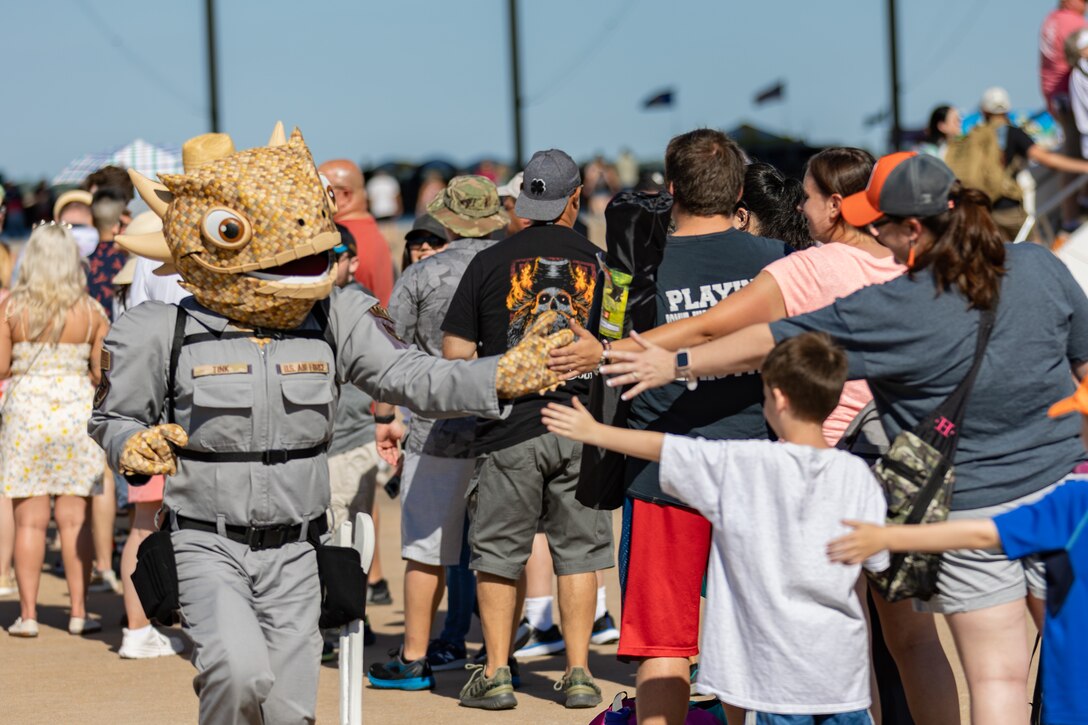 mascot gives crowd high five