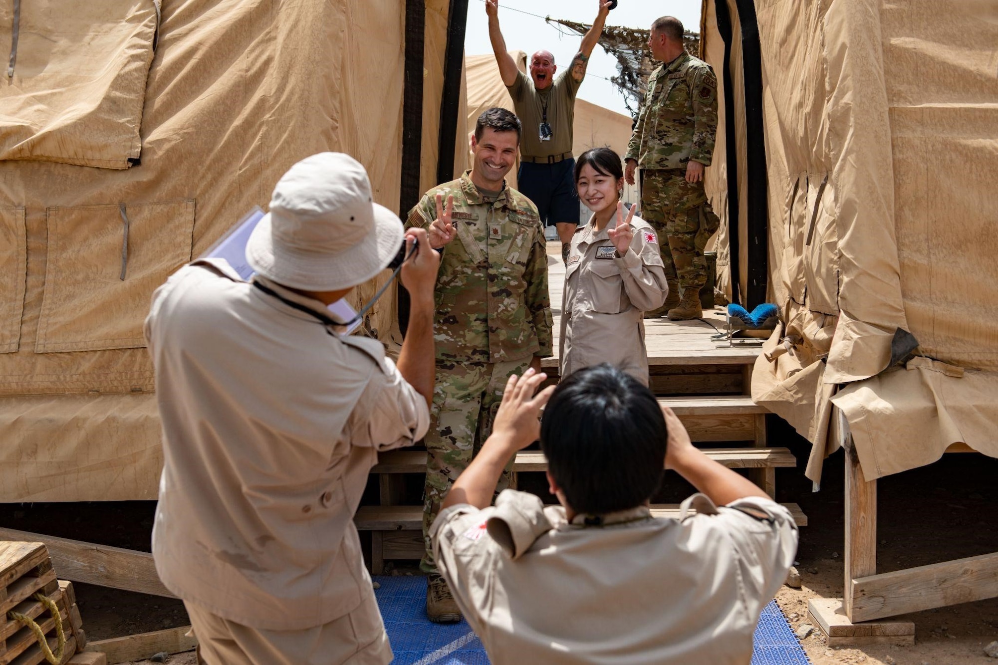 Photo of two service members having their photo taken