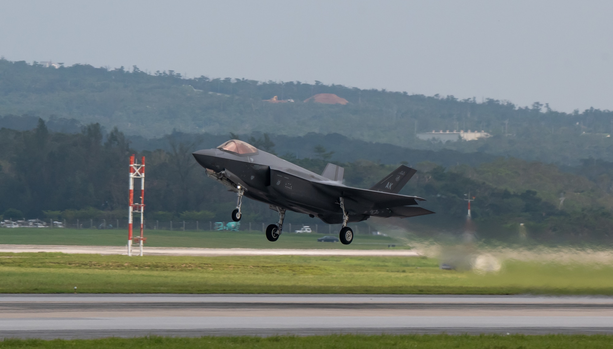 An F-35A Lightning II takes-off on a runway.