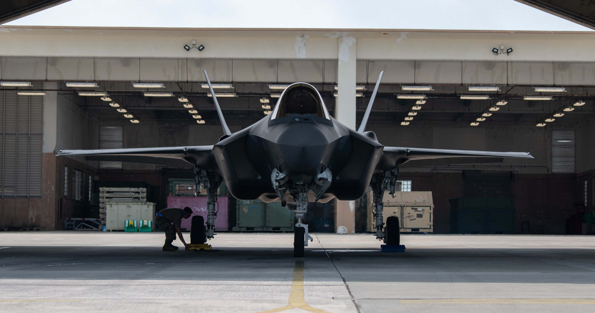 An  F-35A Lightning II sits in a hangar.