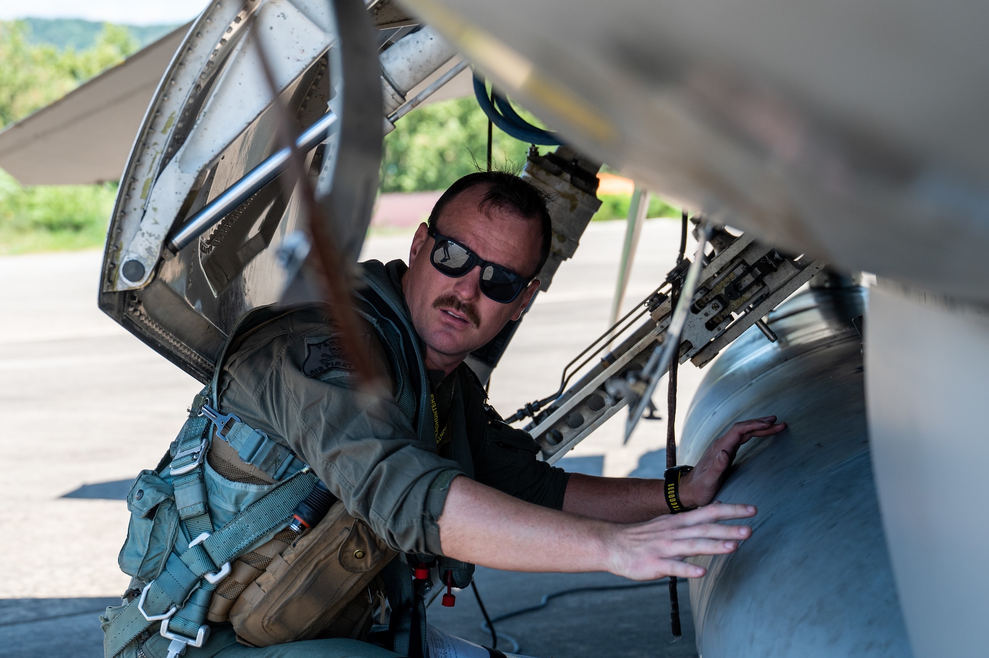 Capt. Jonathon Clements inspects a U.S. Air Force F-16 Fighting Falcon before take-off during a U.S.-Republic of Korea Buddy Squadron event.