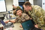 Personnel from the United States, Kazakhstan, Kyrgyzstan, Mongolia, Pakistan, Tajikistan, Turkmenistan and Uzbekistan work together Aug. 12, 2023, during Exercise Regional Cooperation 23 at the Helena Aviation Readiness Center in Helena, Montana. RC23 is an annual, multinational ,U.S. Central Command-sponsored exercise conducted by U.S. forces in partnership with Central and South Asia nations.