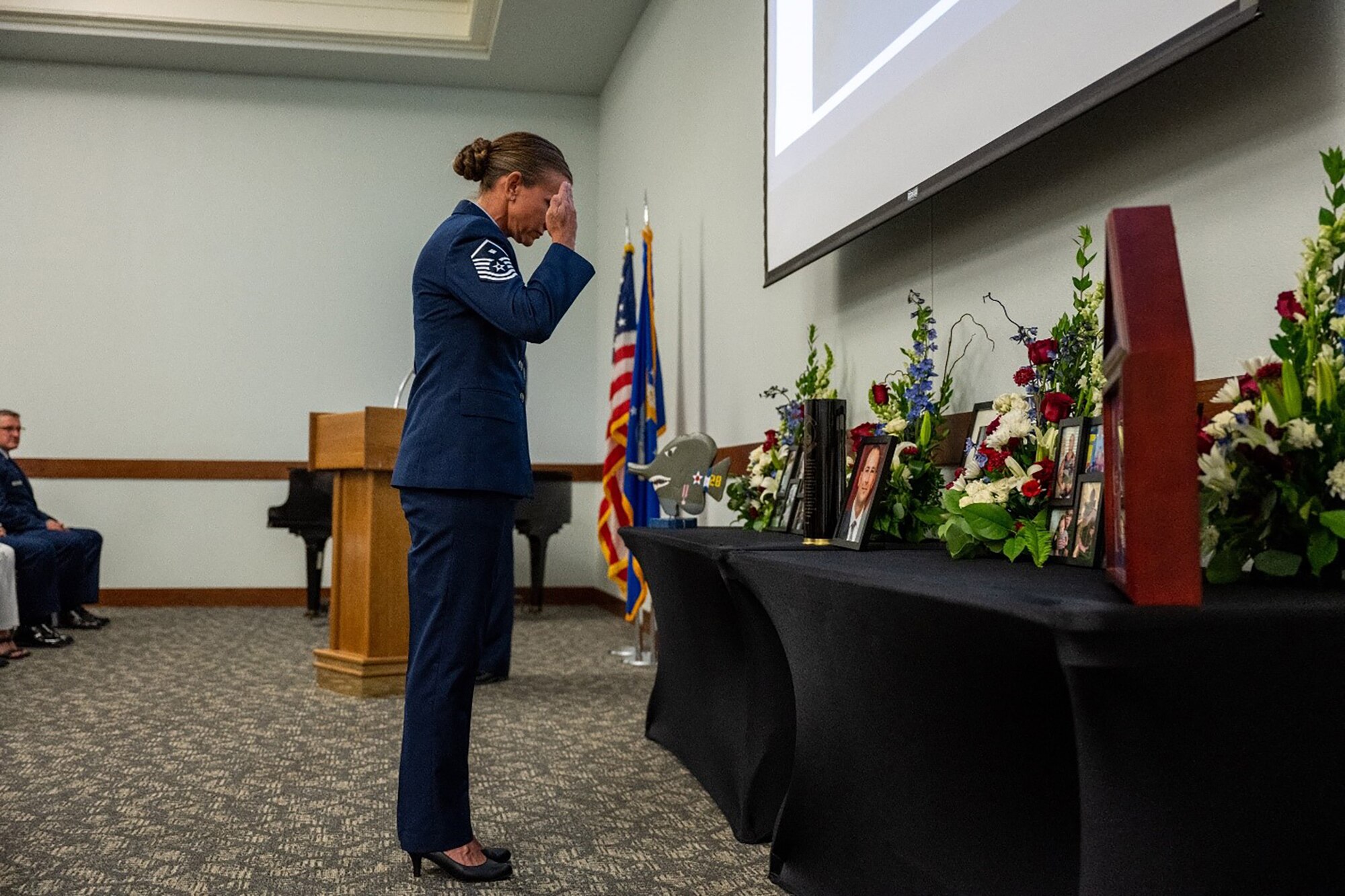 28th Intelligence Squadron First Sergeant Master Sgt. Lisa Abell, renders the final salute at the unit memorial for Tech. Sgt. Sean Jeremy Miller Aug. 6, 2023.The 28 IS conducted a unit memorial during the August unit training assembly to celebrate the life of one of its members who recently passed away.