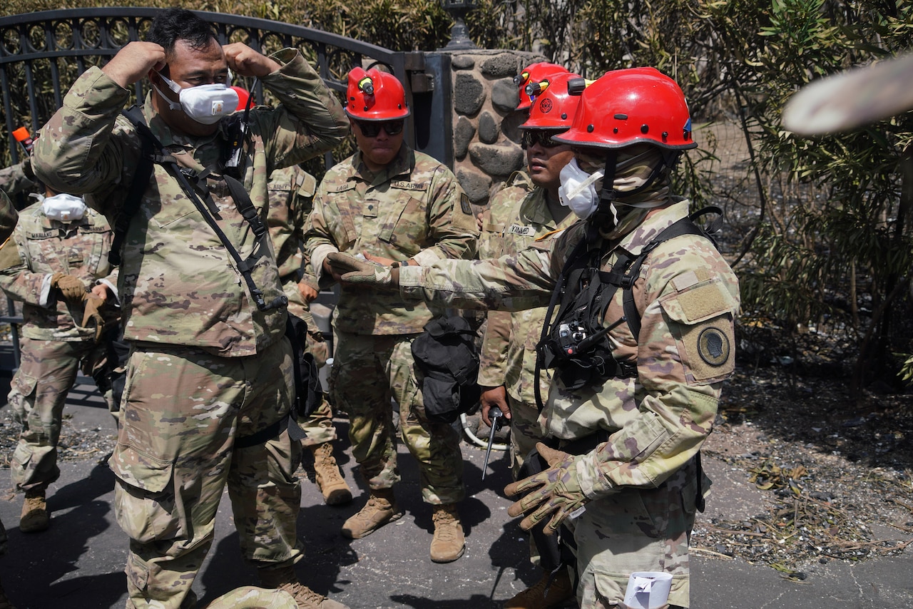National Guard members assess wildfire damage in Maui, Hawaii.
