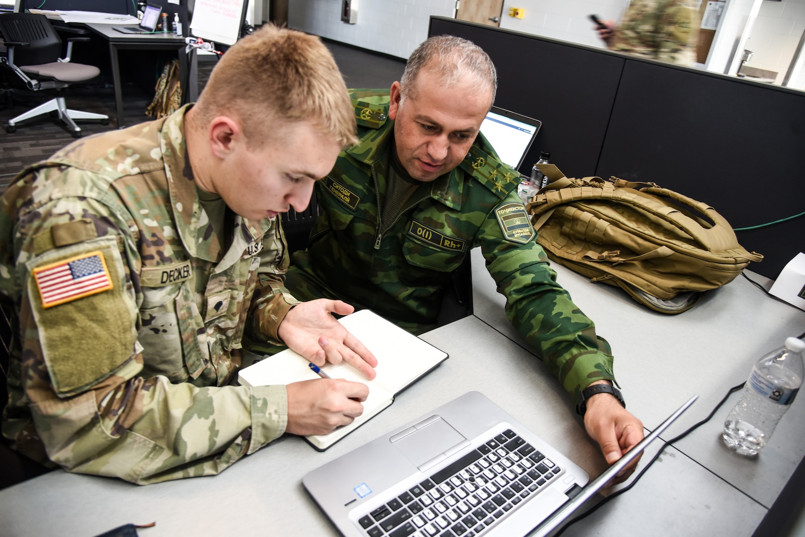 Personnel from the United States, Kazakhstan, Kyrgyzstan, Mongolia, Pakistan, Tajikistan, Turkmenistan and Uzbekistan work together Aug. 12, 2023, during Exercise Regional Cooperation 23 at the Helena Aviation Readiness Center in Helena, Montana. RC23 is an annual, multi-national U.S. Central Command-sponsored exercise conducted by U.S. forces in partnership with Central and South Asia nations. The exercise aims to strengthen relationships between participating nations, as well as increase the capacity and capability to work together. (U.S. Army National Guard photo by Sgt. 1st Class Terra C. Gatti)