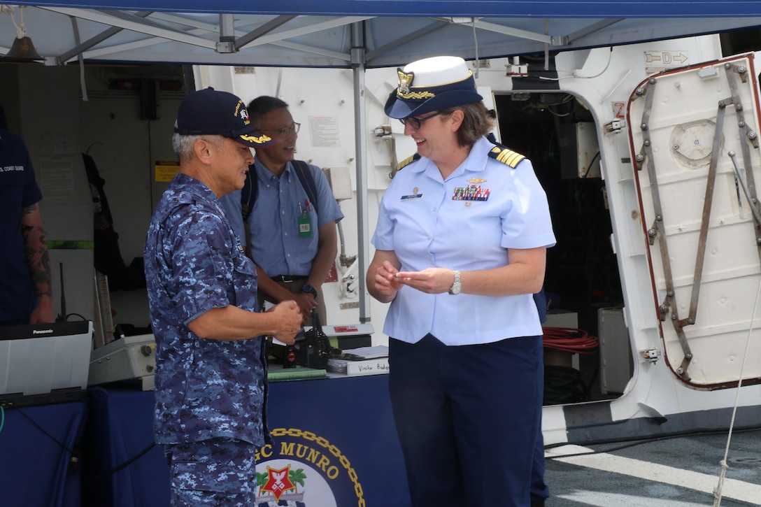 Capt. Rula Deisher, U.S. Coast Guard Cutter Munro’s (WMSL 755) commanding officer, welcomes members from the Japan Maritime Self-Defense Force aboard the Munro during the cutter’s port call to Yokosuka, Japan, Aug. 8, 2023. Yokosuka was Munro’s first international port call during their months-long deployment to the Indo-Pacific region. (U.S. Coast Guard photo)