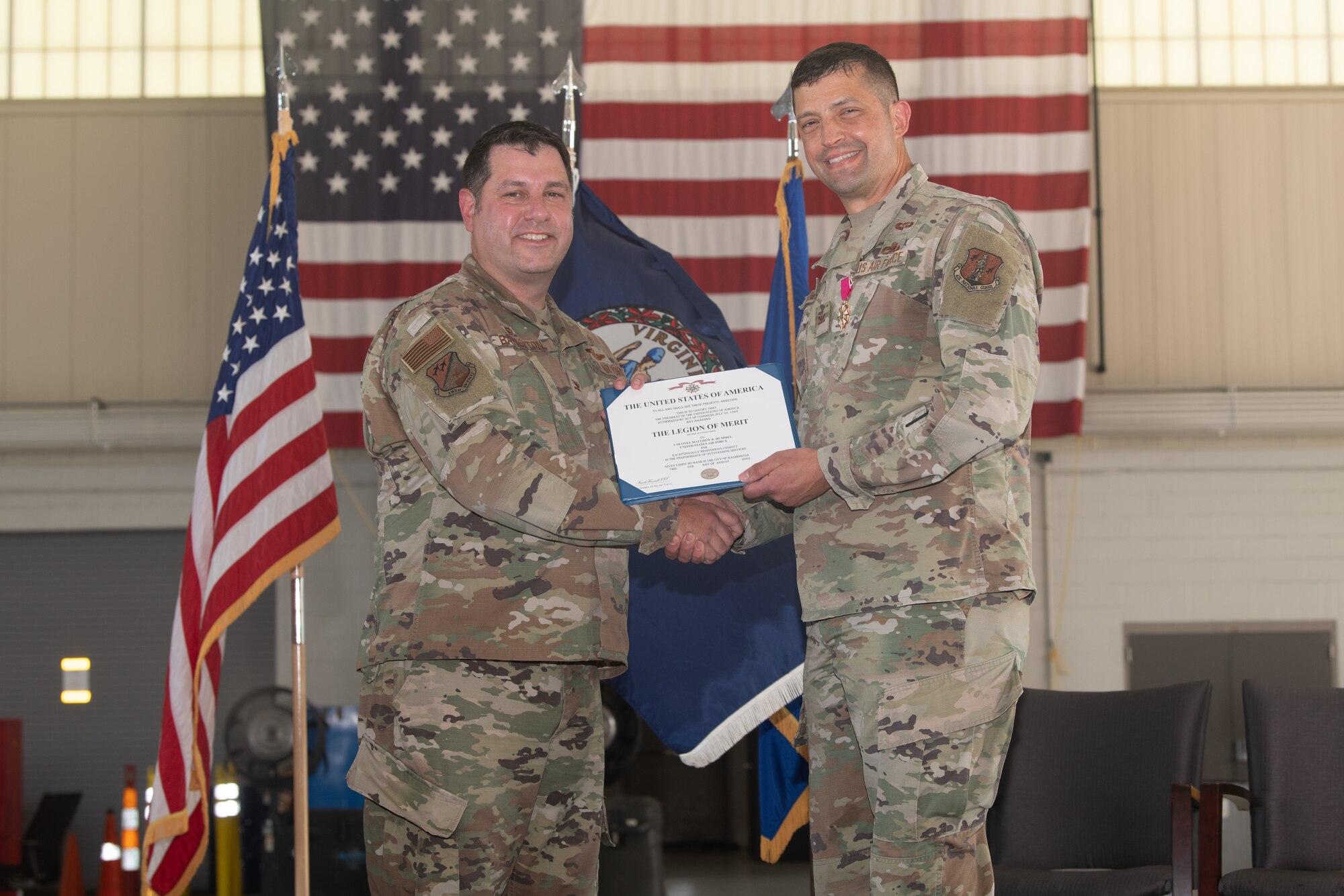 Col. Chris Batterton and Col. Matthew Hummel pose for a photo with award.