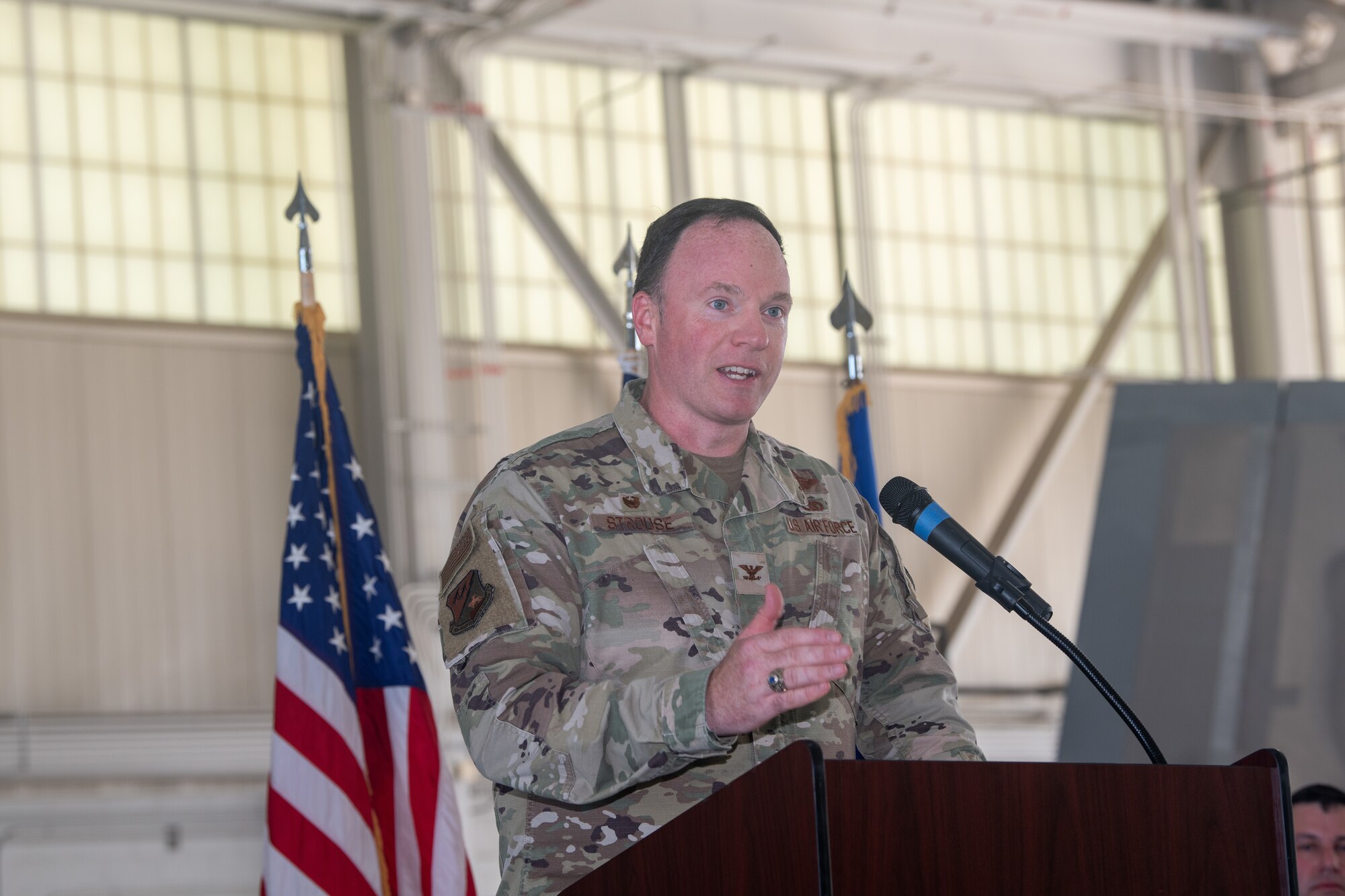 Col. Timothy Strouse speaks at a podium.