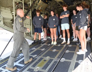 STEM campers receive a preflight safety briefing for the HC-130J Combat King II rescue aircraft at Westhampton Beach, N.Y., Aug. 6, 2023. The science, technology, engineering and math camp is a comprehensive approach with blocks of instruction and hands-on teamwork, for practical application leading to a military capstone event.