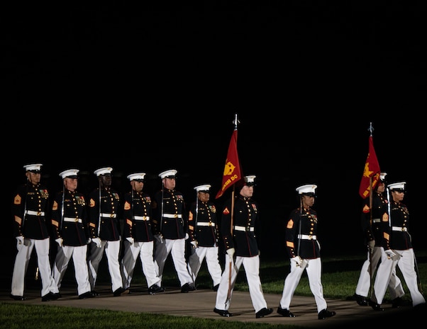 Barracks Marines execute “officers center” during a Friday Evening Parade at Marine Barracks Washington, Aug 12, 2022. The hosting official for the evening was Sgt Maj. Troy E. Black, 19th Sergeant Major of the Marine Corps. The guests of honor were Sgt Maj. Alford L. McMichael, 14th Sergeant Major of the Marine Corps and Sgt Maj. Lewis G. Lee, 13th Sergeant Major of the Marine Corps.