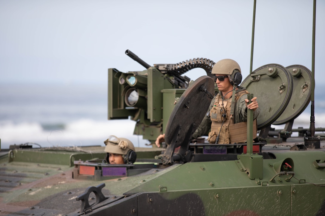 U.S. Marines with 3d Assault Amphibian Battalion, 1st Marine Division, stand by after a platoon training event at Marine Corps Base Camp Pendleton, California, March 12, 2022. The demonstration of proficiency in platoon-level operations marks the next step in certifying ACV crew members and their vehicles for worldwide deployment. (U.S. Marine Corps photo by 2nd Lt. Joshua Estrada)