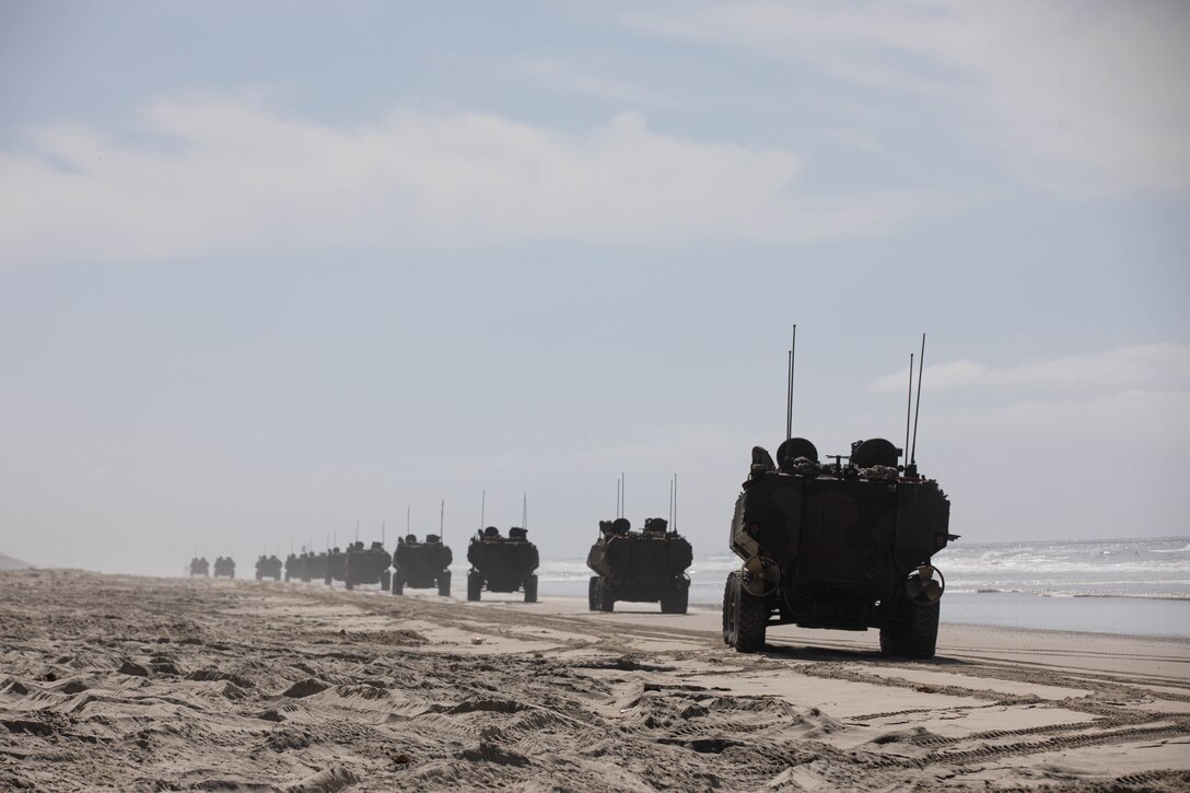 U.S. Marine Corps amphibious combat vehicles (ACVs) with 3d Assault Amphibian Battalion, 1st Marine Division, conduct movement on the shore after a successful training evolution at Marine Corps Base Camp Pendleton, California, March 13, 2022. The demonstration of proficiency in platoon-level operations marks the next step in certifying ACV crew members and their vehicles for worldwide deployment. (U.S. Marine Corps photo by 2nd Lt. Joshua Estrada)