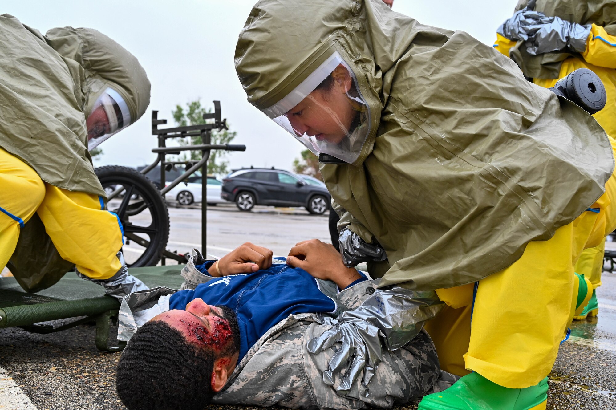 5th Medical Group Patient Decontamination Team first responders assess a patient during Exercise Ready Eagle at Minot Air Force Base, North Dakota, Aug. 10, 2023. Exercises like Ready Eagle are crucial to ensuring our response to the worst case scenario is as proficient as it can be and ultimately save as many of our most important assets, our Airmen. (U.S. Air Force photo by Senior Airman Zachary Wright)