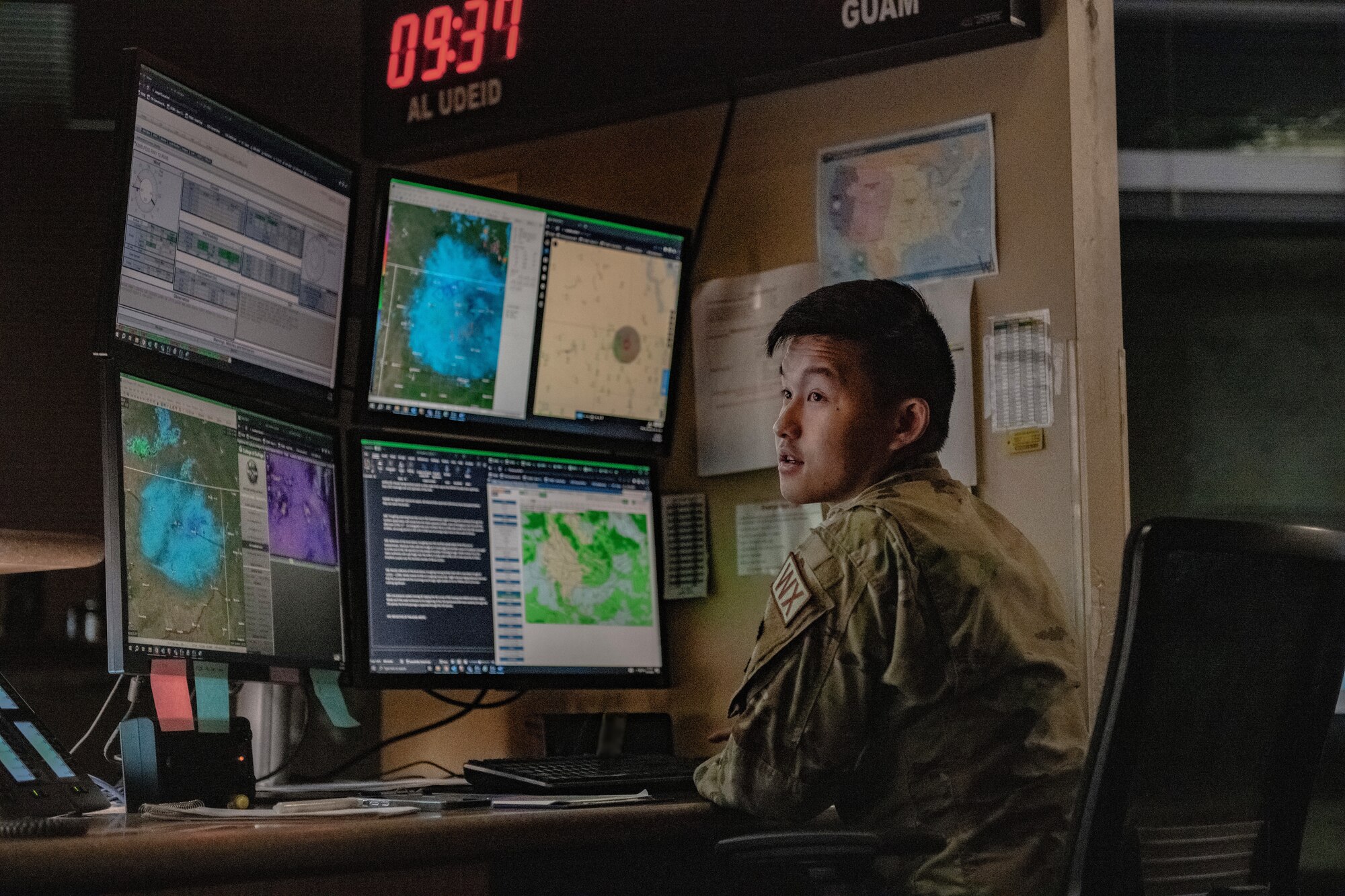 U.S. Air Force Airman 1st Class Benjamin Lo, 5th Operations Support Squadron weather forecaster, monitors the weather during Warbird Week at Minot Air Force Base, North Dakota, Aug. 11, 2023. The 5th OSS weather flight is responsible for forecasting and monitoring changes in weather to protect aircraft and assets from severe weather. Warbird Week is a multi-exercise event conducted by the 5th Bomb Wing to enhance training on generating nuclear-capable bombers capable of striking globally anytime, anywhere. (U.S. Air Force photo by Airman 1st Class Alyssa Bankston)