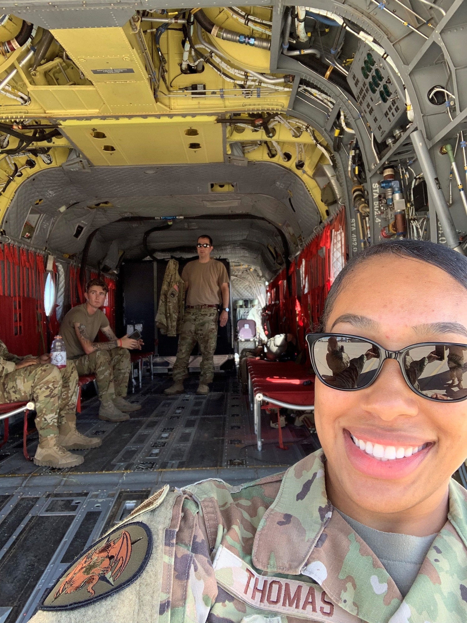 Tech Sgt. Bionca Thomas, Detachment 2 of the 9th Operations Group, takes a photo in a CH-47 helicopter during a recent training exercise. Thomas recently achieved the rare milestone of achieving her Ph.D. Within the Air Force Enlisted Force, just 0.0377% possess professional or doctorate degrees.
