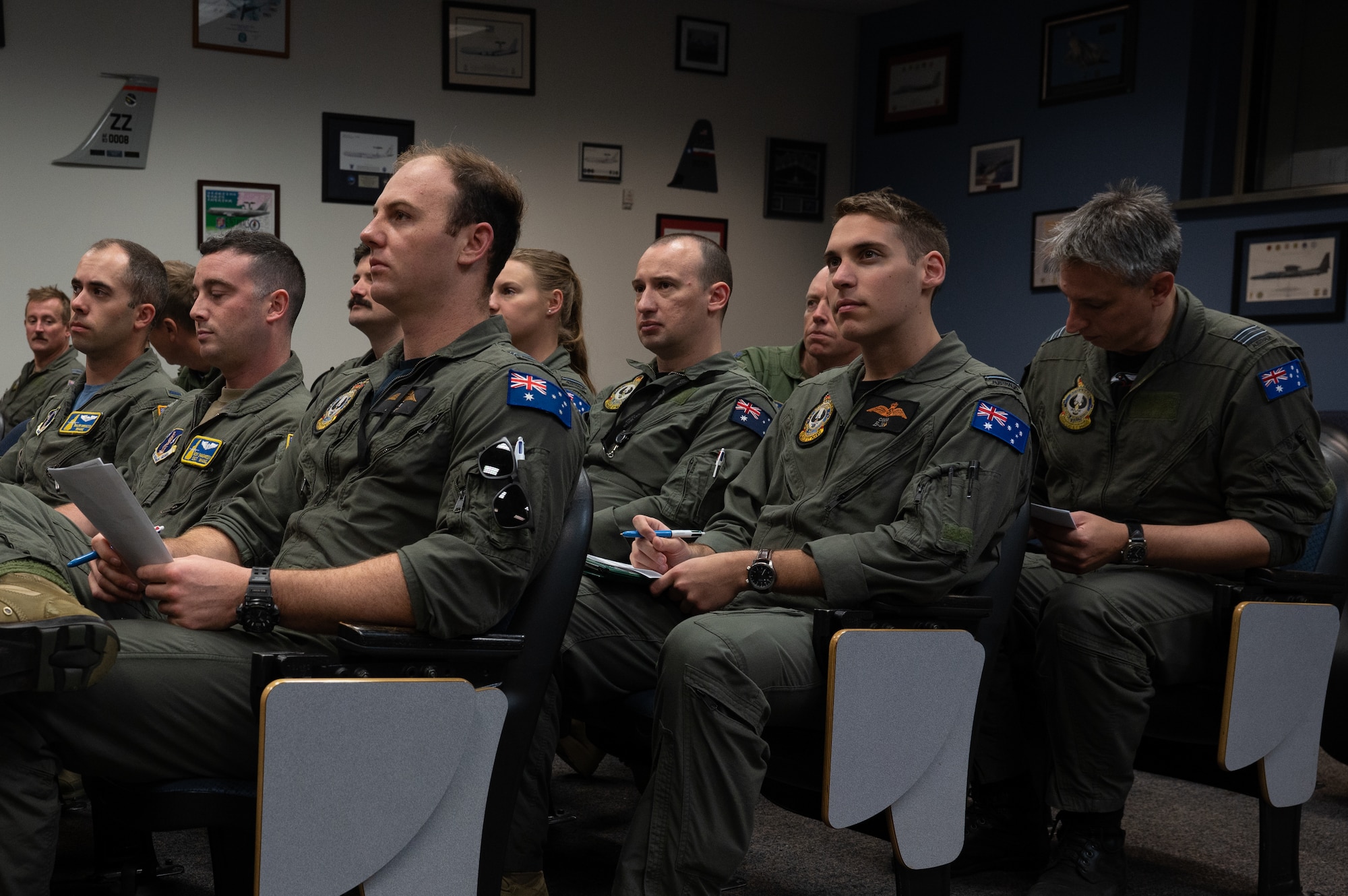 U.S. Air Force and Royal Australian Air Force flight crew members attend a pre-brief