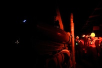 Sailors assigned to the Arleigh Burke-class guided-missile destroyer USS Porter (DDG 78) prepare to launch a rigid hull inflatable boat to transfer rescued civilian divers to United States Coast Guard 115 47 FT Motor Lifeboat CG47287 off the coast of Wilmington, N.C. Porter’s assistance in rescuing the divers is an example of the U.S. Navy’s unique multi-role mission to ensuring safety at sea.