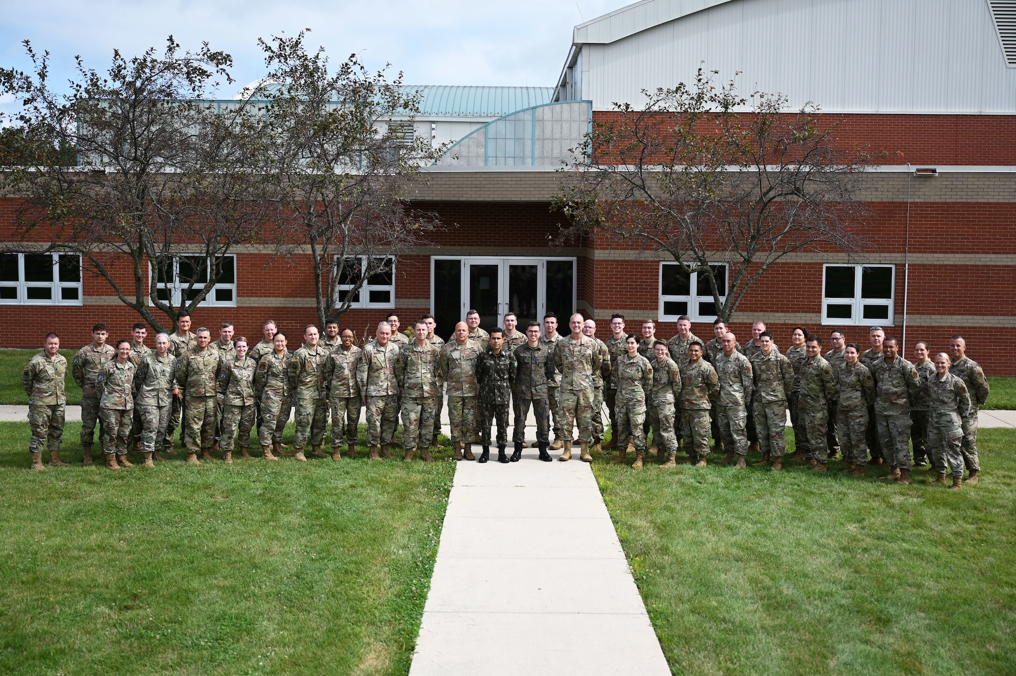 Members of the Vulcan Guard BOLT 5 exercise stand for a group photo Aug. 10, 2023, during Vulcan Guard, a space-focused exercise incorporating several diverse space weapons systems in realistic threat-based scenarios and hosted at the 178th Wing in Springfield, Ohio. Personnel from all seven National Guard states that conduct space operations, U.S. Space Command and the Brazilian military participated in the week-long exercise.