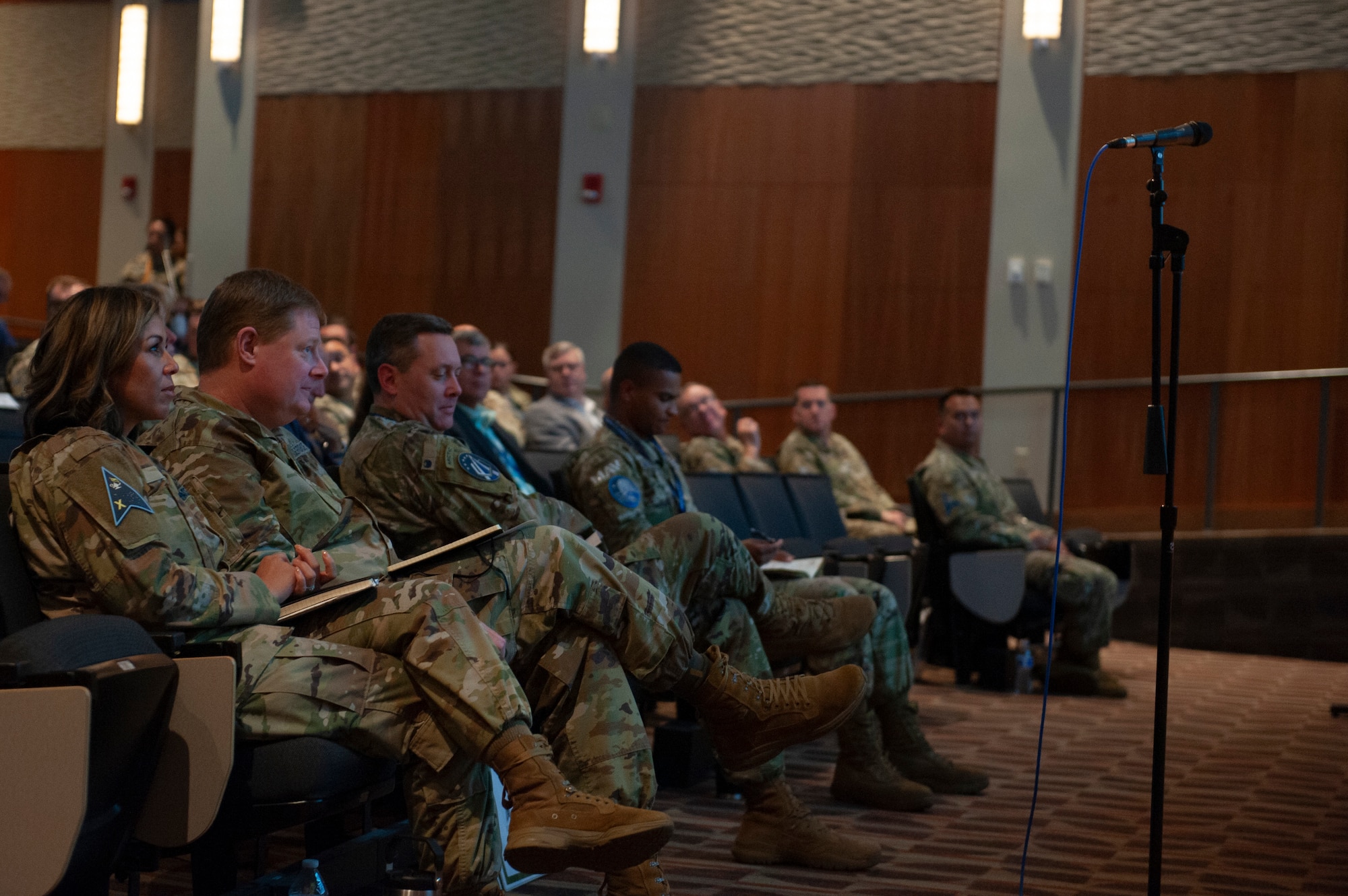 Conference attendees listen to a presentation during the inaugural U.S. Space Force Tactics Development Conference at the National Air and Space Intel Center, Wright Patterson Air Force Base, Ohio, July 26, 2023. Drawing a crowd of 240 attendees, the conference aimed to present the previous year's findings from the U.S. Space Force’s Mission Focused Working Groups and Tactics Improvement Proposals to senior leadership. (U.S. Air Force photo by Senior Airman Kristof Rixmann)