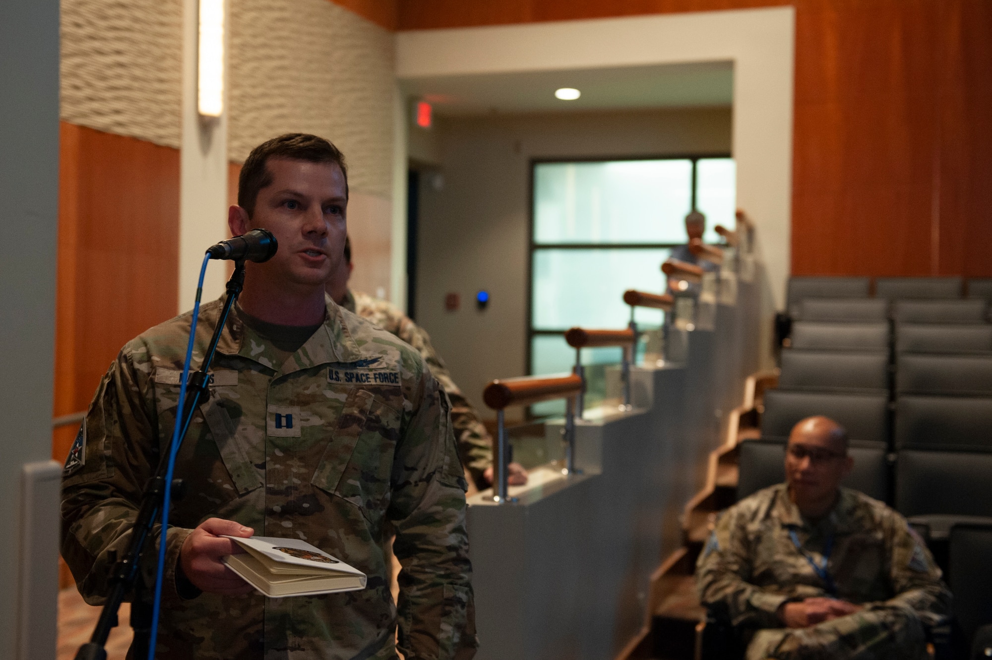 A U.S. Space Force service member asks a question during the inaugural U.S. Space Force Tactics Development Conference at the National Air and Space Intel Center, Wright Patterson Air Force Base, Ohio, July 26, 2023. Drawing a crowd of 240 attendees, the conference aimed to present the previous year's findings from the U.S. Space Force’s Mission Focused Working Groups and Tactics Improvement Proposals to senior leadership. (U.S. Air Force photo by Senior Airman Kristof Rixmann)