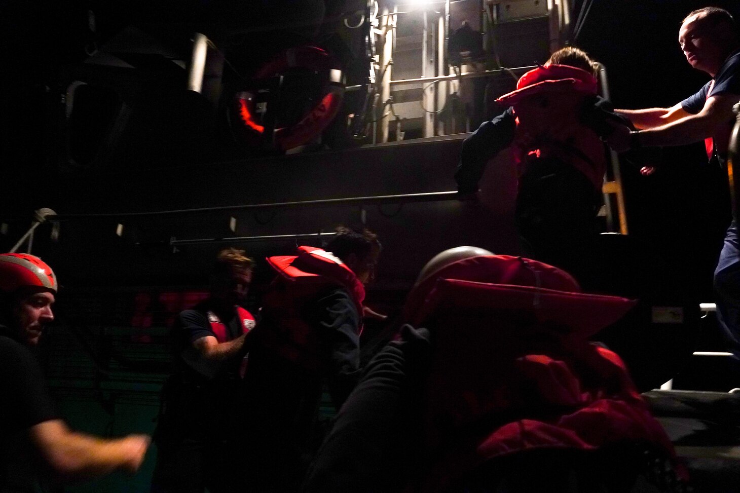 Sailors assigned to Arleigh Burke-class guided-missile destroyer USS Porter (DDG 78) transfer civilian divers to U.S. Coast Guard 115 47-foot Motor Life Boat CG47287 off the coast of Wilmington, N.C. Porter’s assistance in rescuing the divers is an example of the U.S. Navy’s unique multi-role mission to ensuring safety at sea.