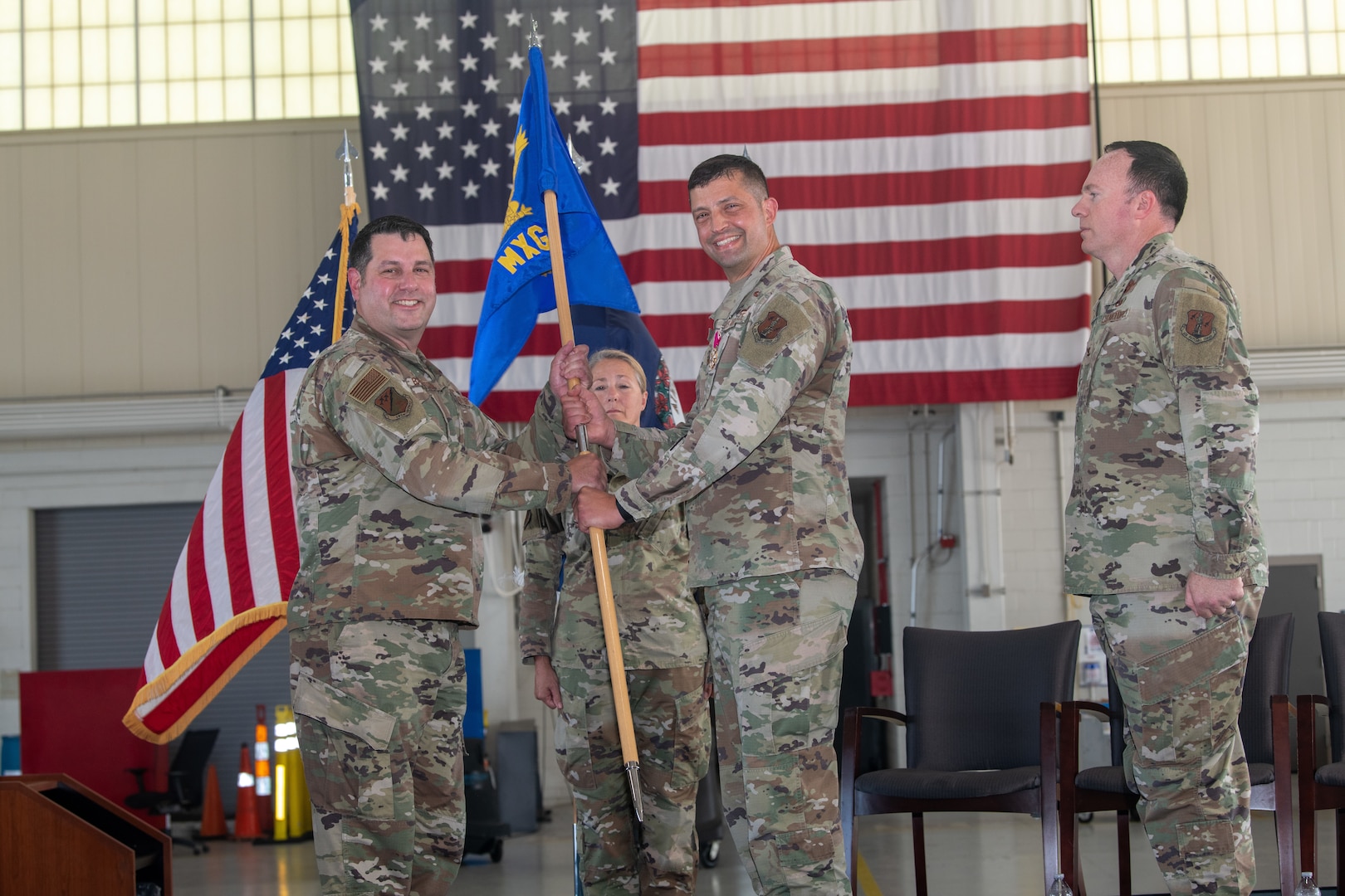 Col. Matthew Hummel passes guidon to Col. Chris Batterton.