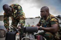 ACCRA, GHANA –– Members of the Ghana Army troubleshoot machinery at the Africa Malaria Task Force (AMTF) conference, July 18, 2023. The AMTF brought experts together from 25 partner nations to address best practices for detection and eradication of malaria throughout Africa, with a specific focus on the emerging threat from the invasive malaria-causing species, Anopheles stephensi.