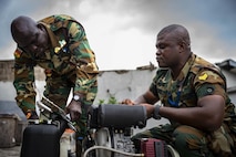 ACCRA, GHANA –– Members of the Ghana Army troubleshoot machinery at the Africa Malaria Task Force (AMTF) conference, July 18, 2023. The AMTF brought experts together from 25 partner nations to address best practices for detection and eradication of malaria throughout Africa, with a specific focus on the emerging threat from the invasive malaria-causing species, Anopheles stephensi.