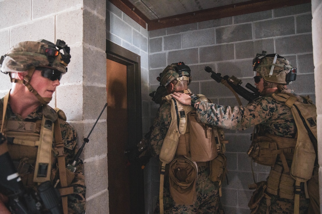 U.S. Marines with 1st Battalion, 8th Marine Regiment, 2d Marine Division, clear a building during Exercise Bold Quest on Fort Stewart, Georgia, Aug. 16, 2022. Bold Quest is an annual collaborative joint and multinational enterprise in which nations, services, and programs pool their resources in a recurring cycle of capability development to demonstrate a joint capability to link sensors to shooters across air, land, sea, space, and cyberspace. (U.S. Marine Corps photo by Lance Cpl. Emma Gray)