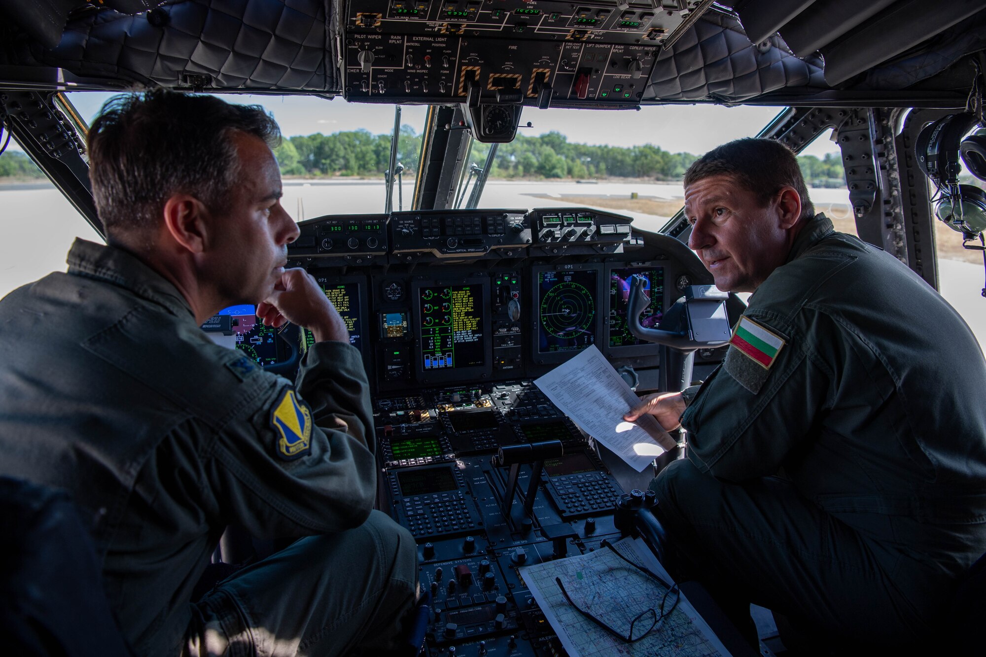 U.S. Air Force Col. Jamil I. Musa, 86th Airlift Wing vice commander, meets with a Bulgarian air force Alenia C-27J Spartan aircraft pilot before the U.S. and Bulgarian interfly during Thracian Summer 2023 out of Bezmer Air Base, Bulgaria, Aug. 9, 2023.