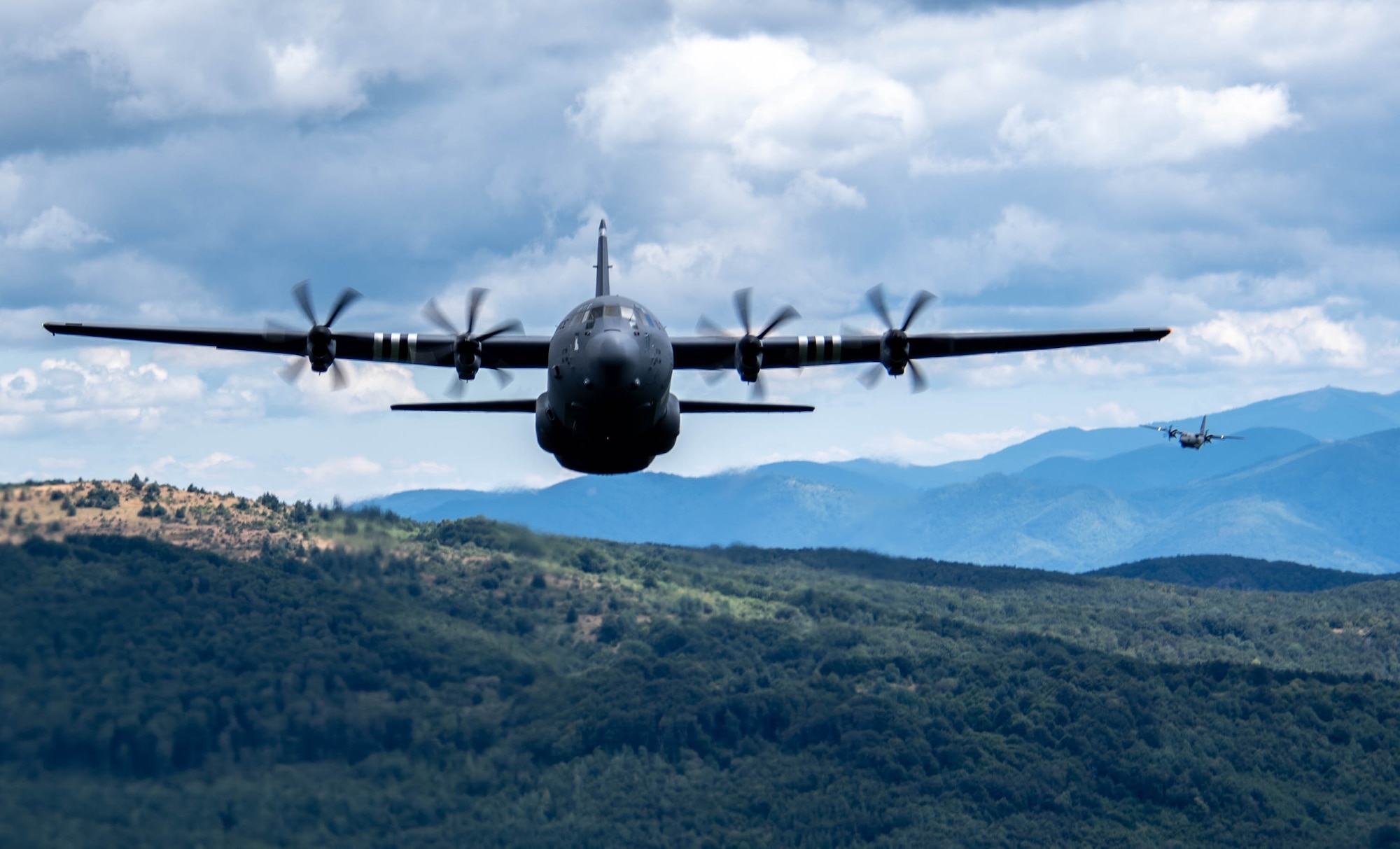 U.S. Air Force C-130J Super Hercules aircraft pilots, from the 37th Airlift Squadron, Ramstein Air Base, Germany, fly in a three plane formation with Bulgarian NATO allies during Thracian Summer 2023 in low level mountain flying out of Bezmer Air Base, Bulgaria, Aug. 9, 2023.