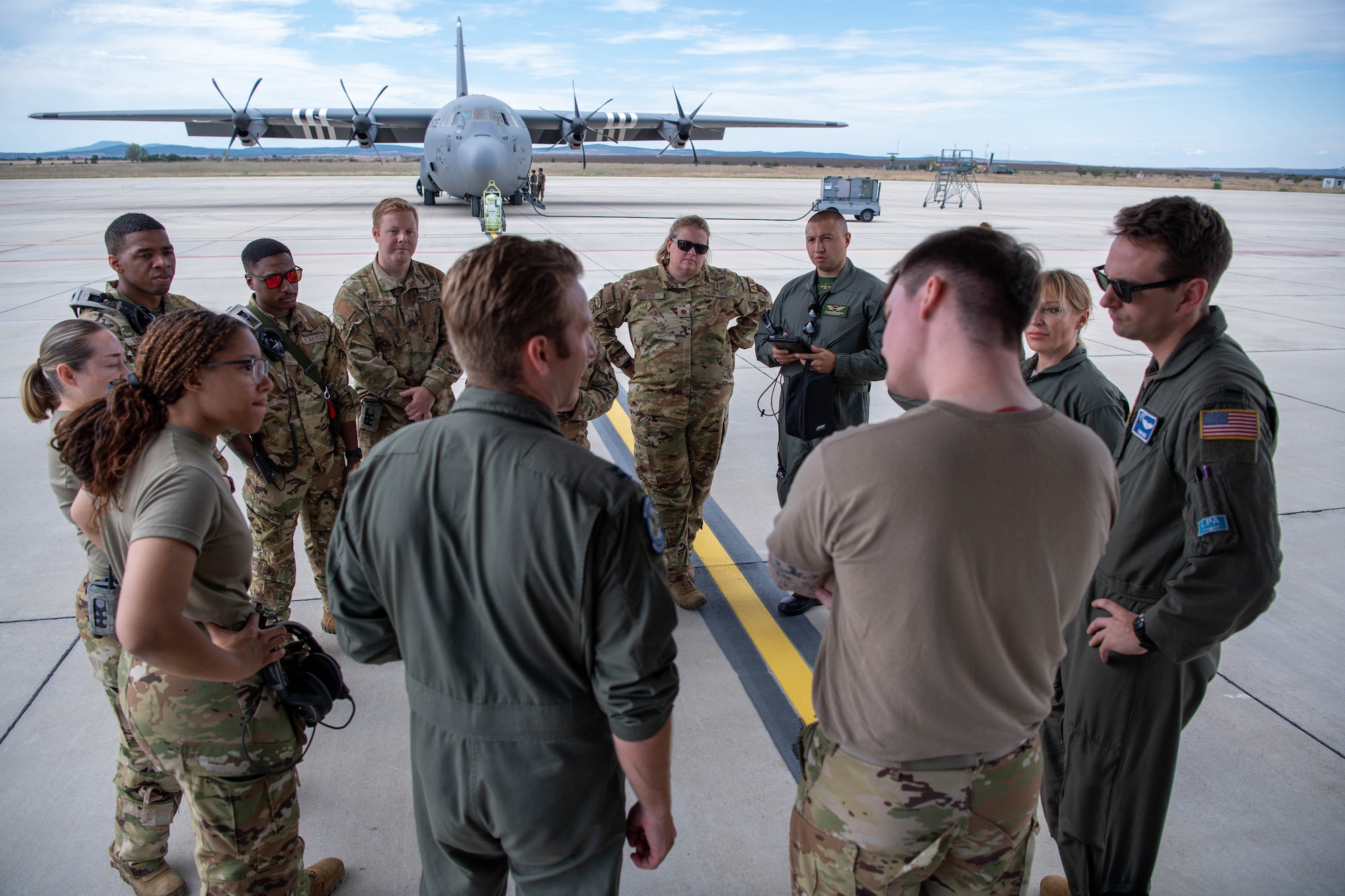 U.S. Air Force members from the 86th Airlift Wing gather for a pre-flight brief with Bulgarian allies during Thracian Summer 2023 at Bezmer Air Base, Bulgaria, Aug. 10, 2023.
