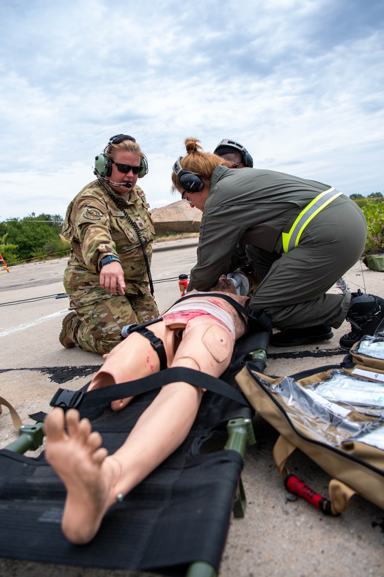 U.S. Air Force Maj. Erica R. Eyer, 86th Aeromedical Evacuation Squadron clinical management flight commander, works with a Bulgarian air force aeromedical evacuation team member during a simulated base attack scenario for Thracian Summer 2023 at Cheshnegirovo Air Base, Bulgaria, Aug. 10, 2023.