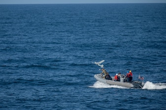 U.S. Marine Sgt. Brian Eakle, from St. Louis, assigned to the 2nd Reconnaissance Battalion under tactical command and control of Task Force 61/2, launches an AeroVironment RQ-20B unmanned aircraft from a rigid-hull inflatable boat (RHIB) as seen from the Arleigh Burke-class guided-missile destroyer USS Roosevelt (DDG 80) in the Baltic Sea, Aug. 5, 2023.