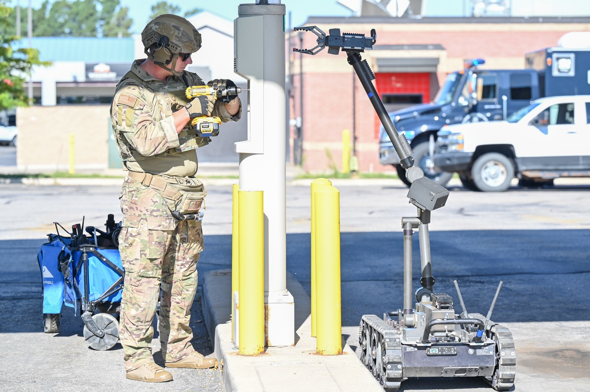 Staff Sgt. Tyler Simpkins, 775th Explosive Ordnance Disposal Flight, cuts into a bank pneumatic tube during the retrieval of a simulated explosive device at an off-base training event Aug. 10, 2023, in Roy, Utah.